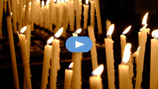 Celebration and Release -- Acceptance and Letting Go tapered candles burning, and some are extinguished.